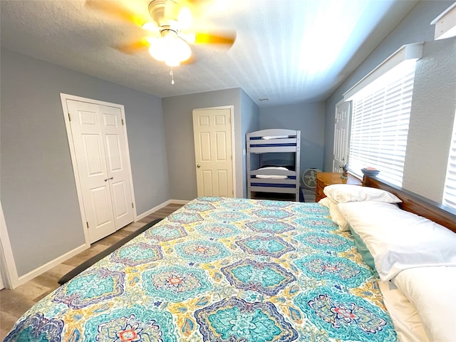 bedroom with ceiling fan and wood-type flooring