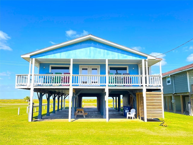 2619 Swan Ct, Surfside Beach, TX 77541 - back of house with a lawn and a carport