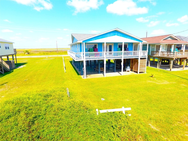 back of house with a yard and a wooden deck