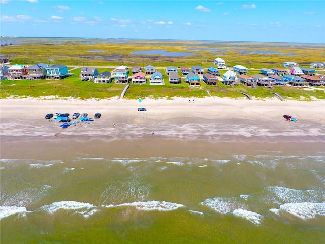 aerial view featuring a water view and a beach view