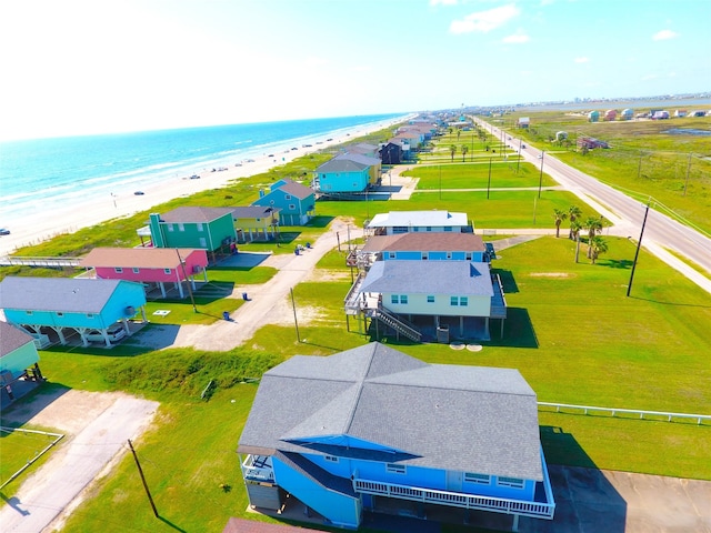 birds eye view of property featuring a water view and a view of the beach