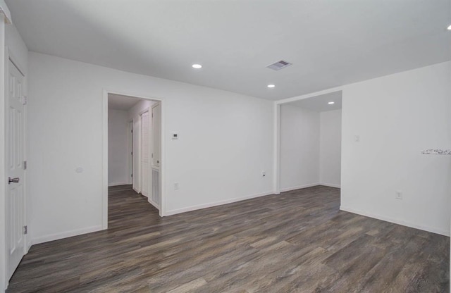 empty room featuring dark wood-type flooring