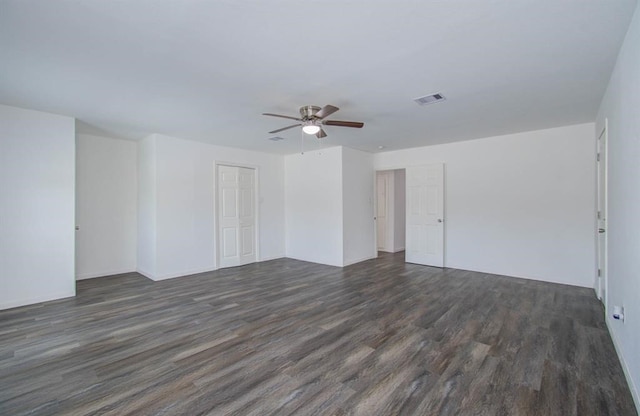 unfurnished room featuring dark hardwood / wood-style flooring and ceiling fan