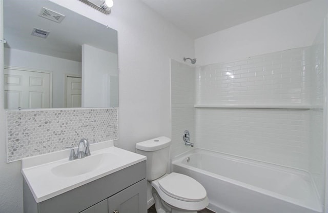 full bathroom featuring toilet, vanity, tasteful backsplash, and tiled shower / bath