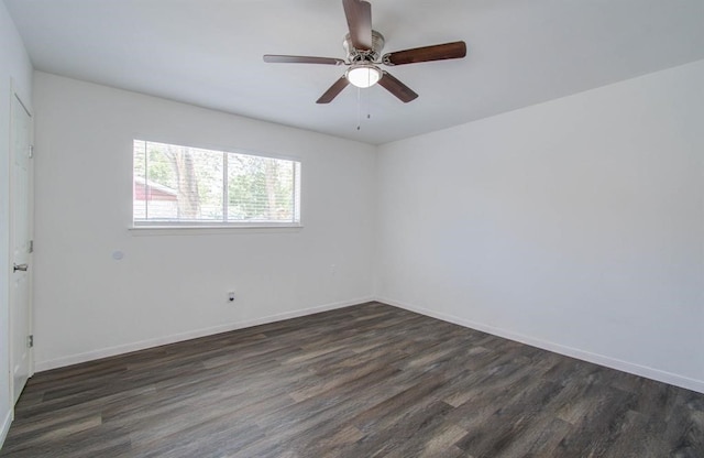 spare room featuring ceiling fan and dark hardwood / wood-style floors