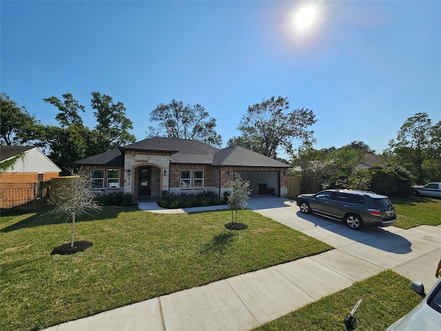 view of front facade with a garage and a front lawn