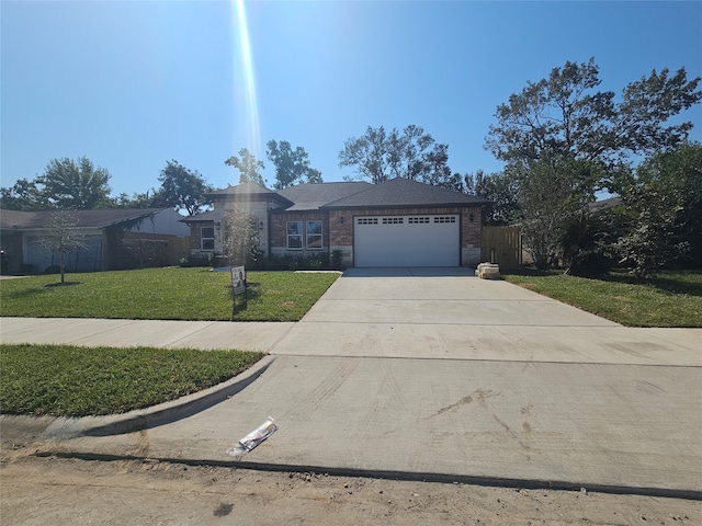 ranch-style house with a front yard and a garage