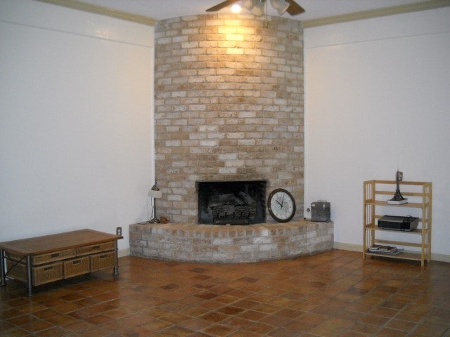 living room with a fireplace and ceiling fan