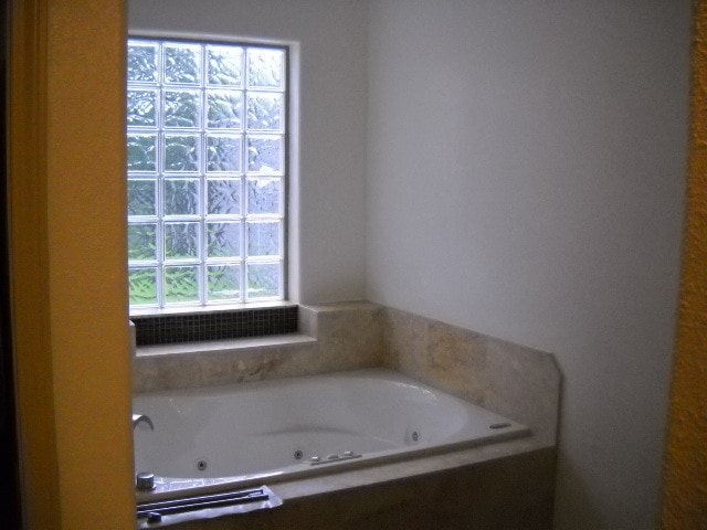 bathroom with a bathing tub