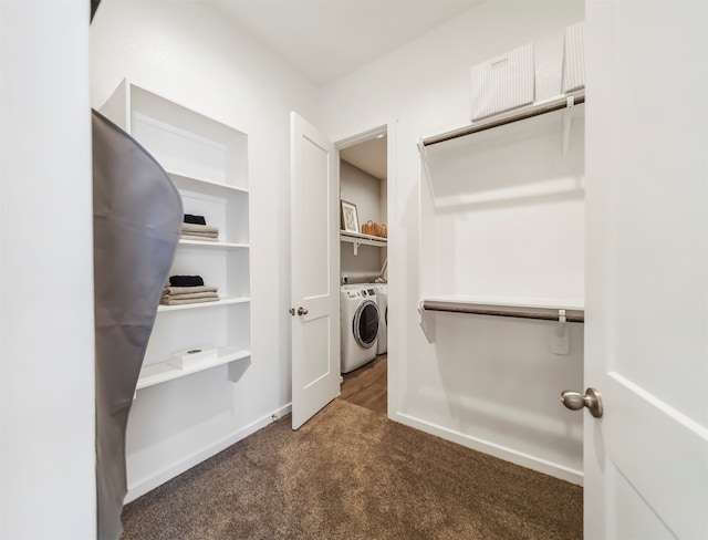 laundry room with dark carpet and washer and dryer