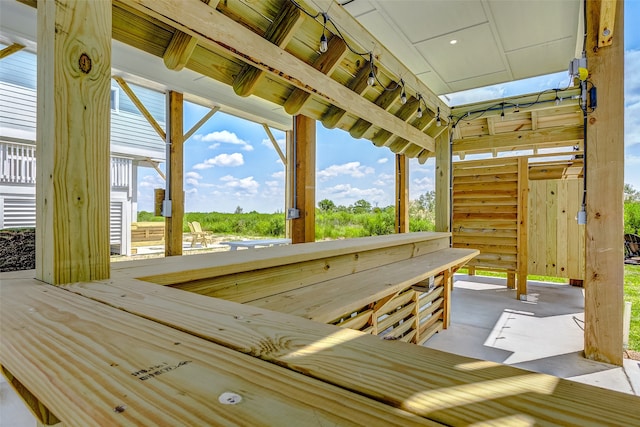 wooden deck with a patio