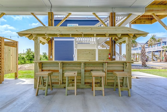 view of patio with an outdoor bar