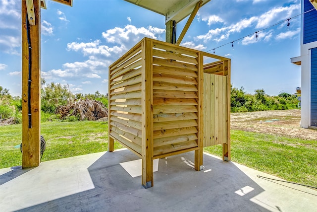 view of outbuilding featuring a lawn