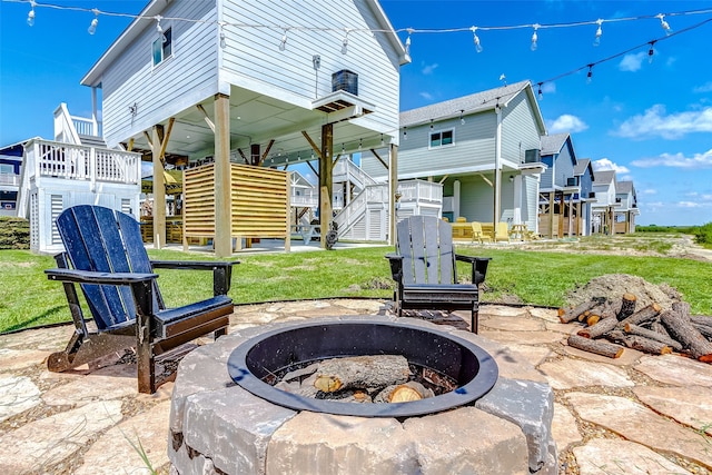 view of patio / terrace featuring a fire pit and a wooden deck