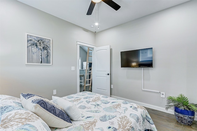 bedroom with ceiling fan and dark hardwood / wood-style flooring