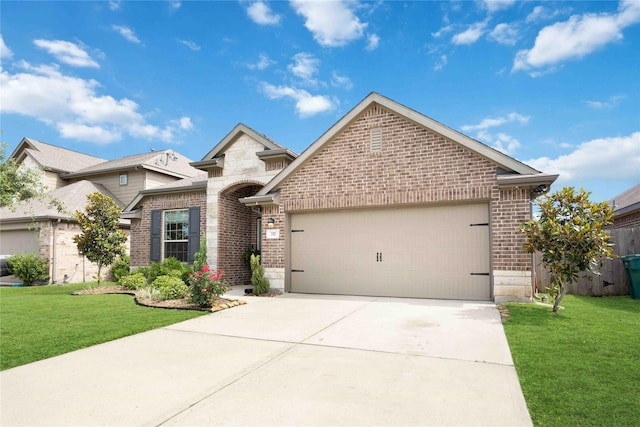 view of front of house with a front yard and a garage