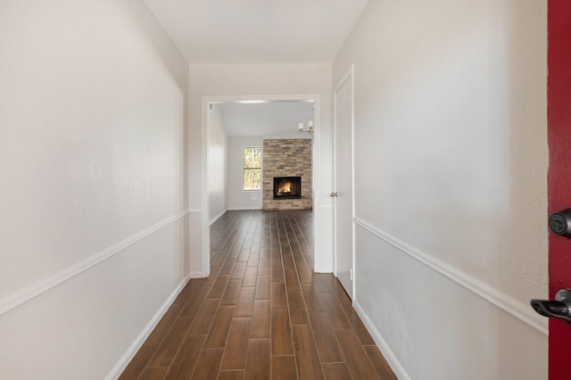 hallway with dark hardwood / wood-style flooring