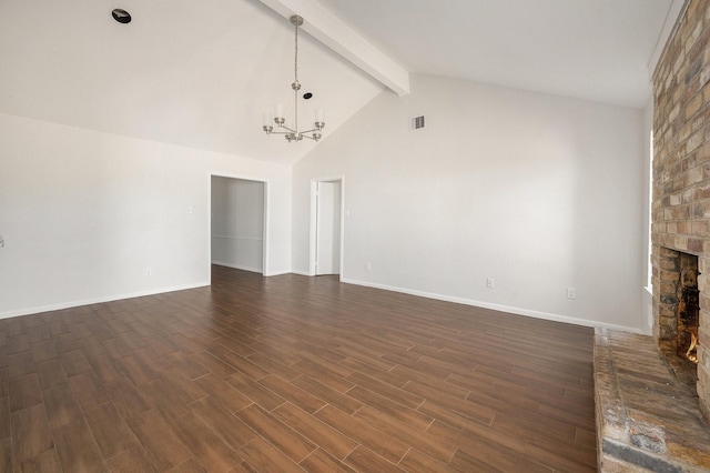 unfurnished living room featuring a fireplace, dark wood-type flooring, beam ceiling, high vaulted ceiling, and a chandelier