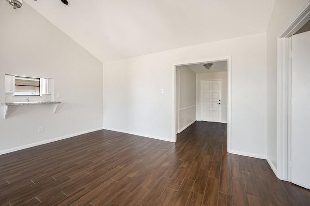 interior space with lofted ceiling and dark wood-type flooring