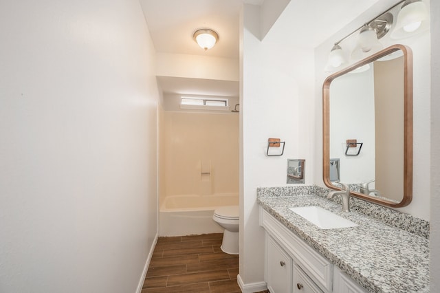 bathroom with vanity, toilet, and wood-type flooring