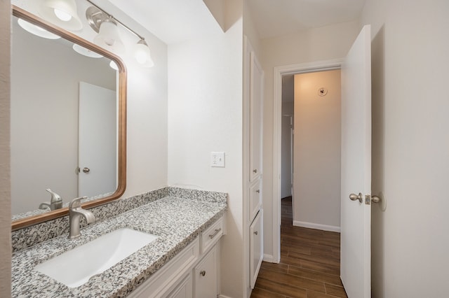 bathroom featuring hardwood / wood-style floors and vanity