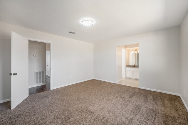 empty room featuring light carpet