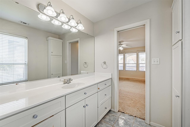 bathroom with tile patterned floors, ceiling fan, and vanity