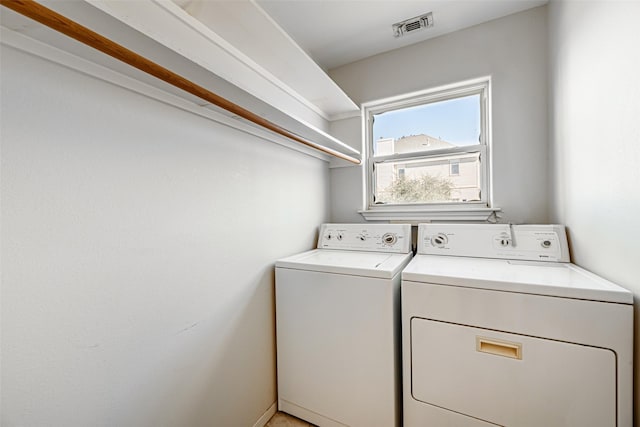 laundry room featuring washing machine and dryer