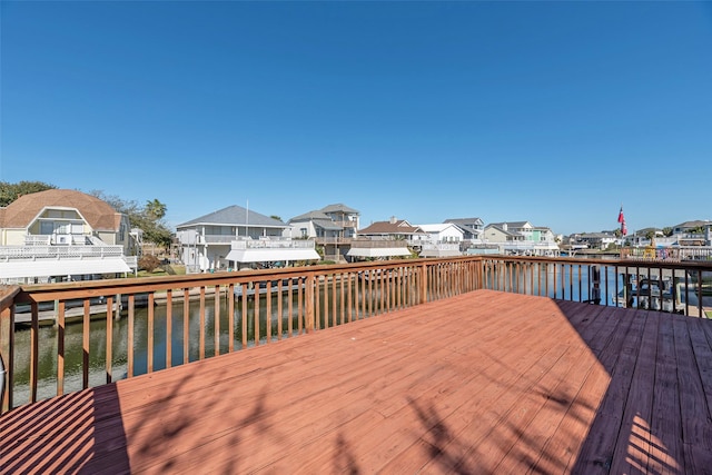 wooden deck with a water view