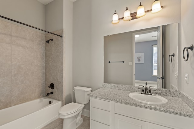 full bathroom with tiled shower / bath, vanity, toilet, and tile patterned flooring