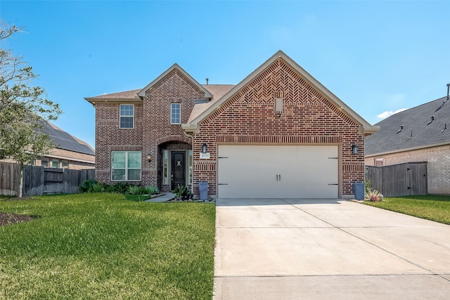 view of property with a garage and a front lawn