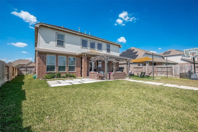 back of property with a patio, a lawn, and a pergola