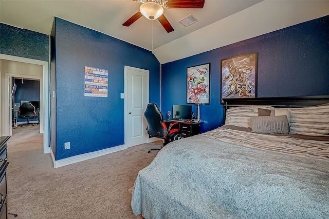 carpeted bedroom featuring lofted ceiling and ceiling fan