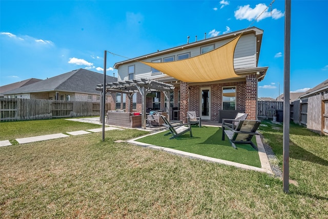 back of property with a patio area, a lawn, and a pergola