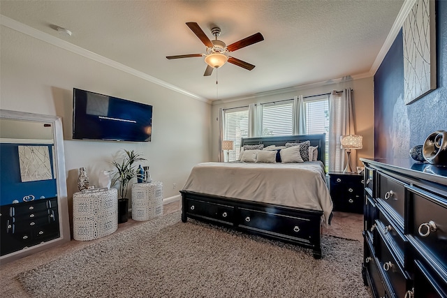 carpeted bedroom featuring ornamental molding, a textured ceiling, and ceiling fan