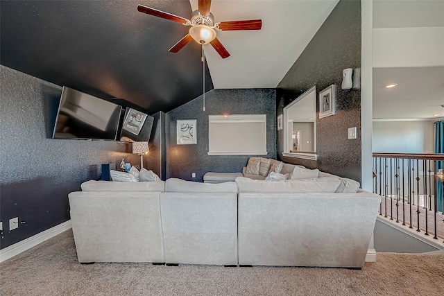 carpeted cinema with lofted ceiling and ceiling fan