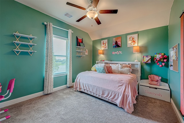 bedroom featuring ceiling fan, vaulted ceiling, and carpet