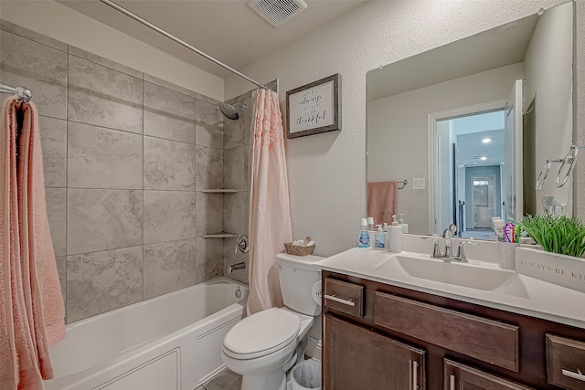 full bathroom with vanity, toilet, and shower / bath combo