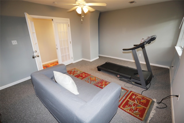 workout room with ceiling fan and carpet floors