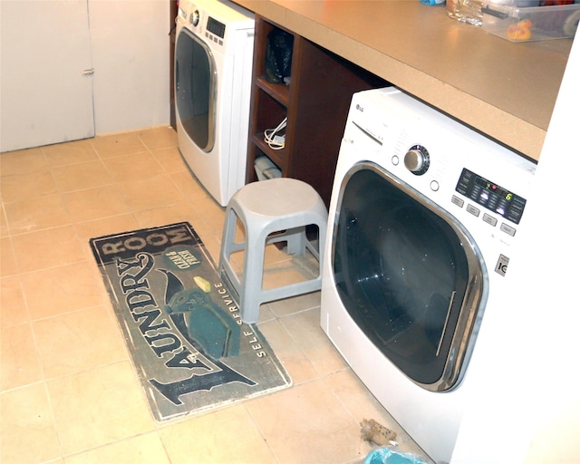 laundry room featuring washer / clothes dryer and tile patterned floors