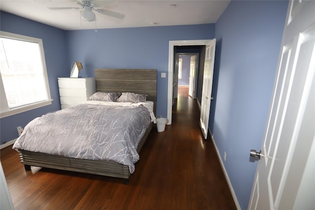 bedroom featuring ceiling fan and dark hardwood / wood-style flooring