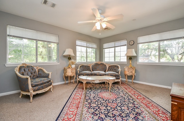 living area featuring ceiling fan and carpet floors