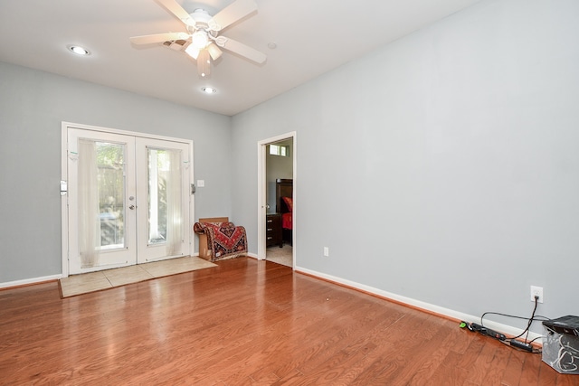 entryway with french doors, light hardwood / wood-style floors, and ceiling fan