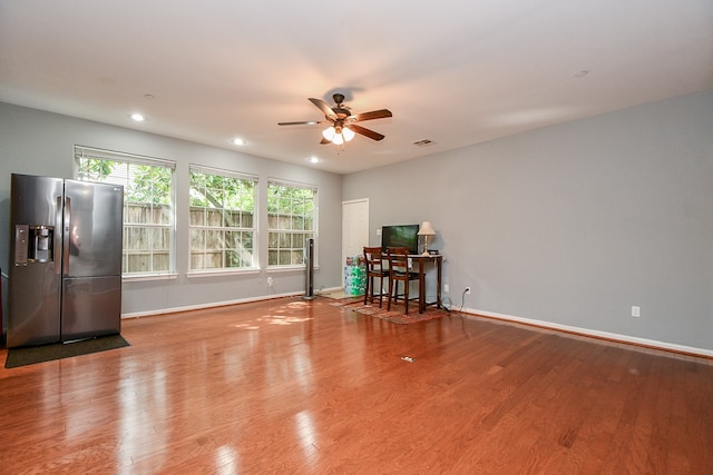 interior space with light wood-type flooring and ceiling fan