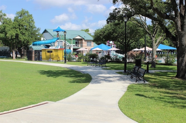 view of home's community featuring a yard