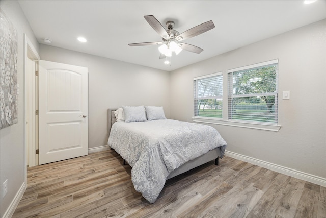 bedroom featuring ceiling fan and hardwood / wood-style floors