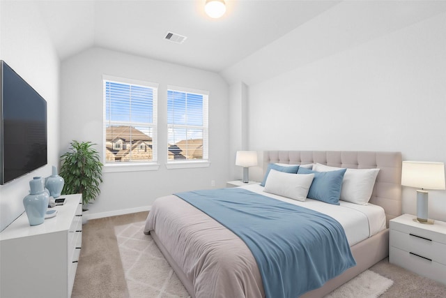 carpeted bedroom featuring vaulted ceiling