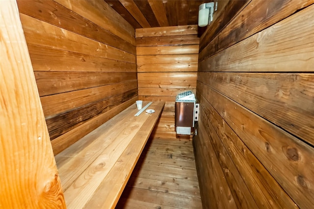 view of sauna with wood walls, hardwood / wood-style floors, and wooden ceiling