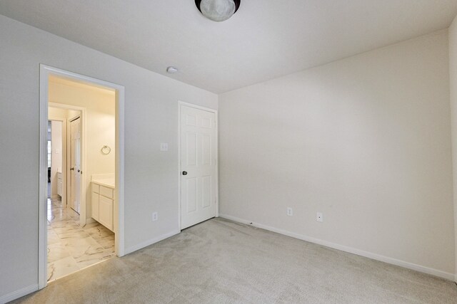 unfurnished bedroom with light carpet