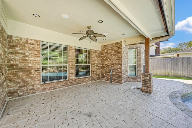 view of patio featuring ceiling fan